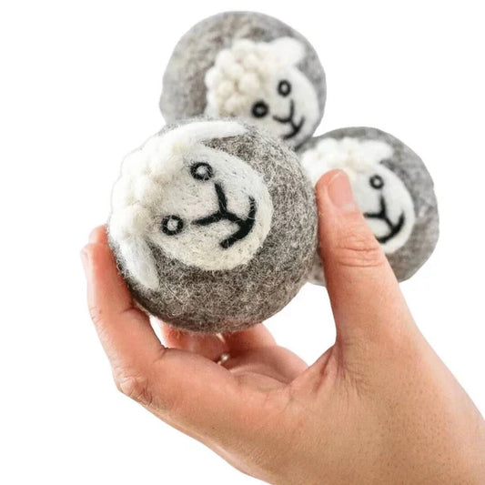 Sheep Wool Dryer Balls set of 3 with sheep designs in hand.