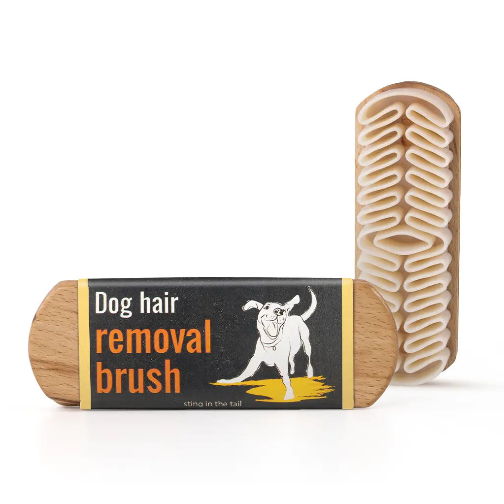 Silicone grooming brush with wooden handle for removing loose hair and reducing shedding.