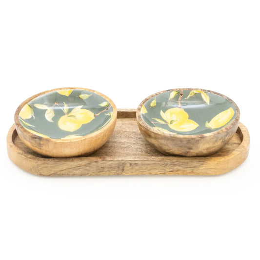 Small mango wood dipping bowls on tray with rustic charm.