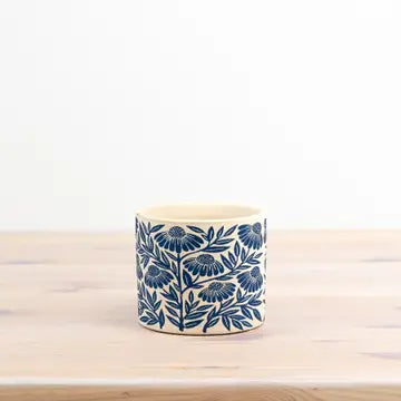 Small flower design planter, 10.5cm with blue floral pattern.