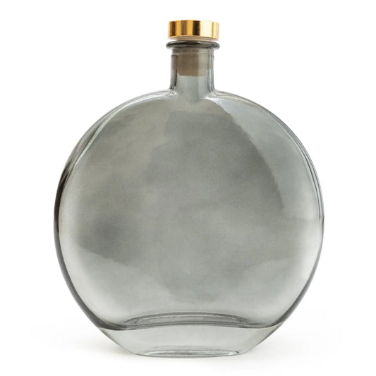 Smokey black oval reed diffuser with bergamot and oud scent, 500ml.