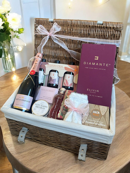 Sparkling Birthday Hamper with champagne, truffles, and pampering items.