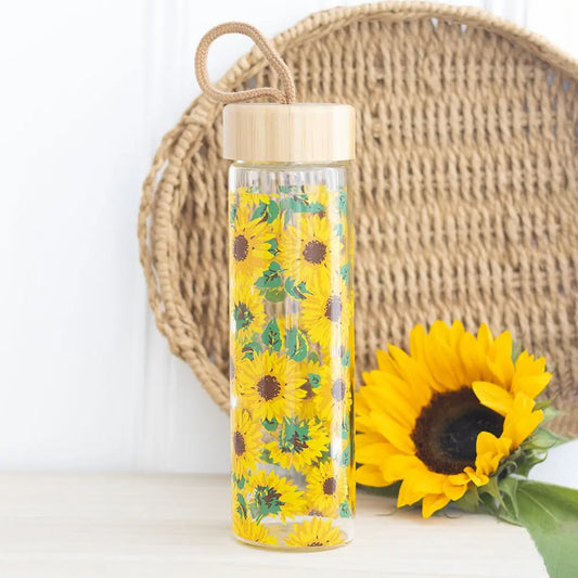 Sunflower print glass water bottle with bamboo lid and cord loop.