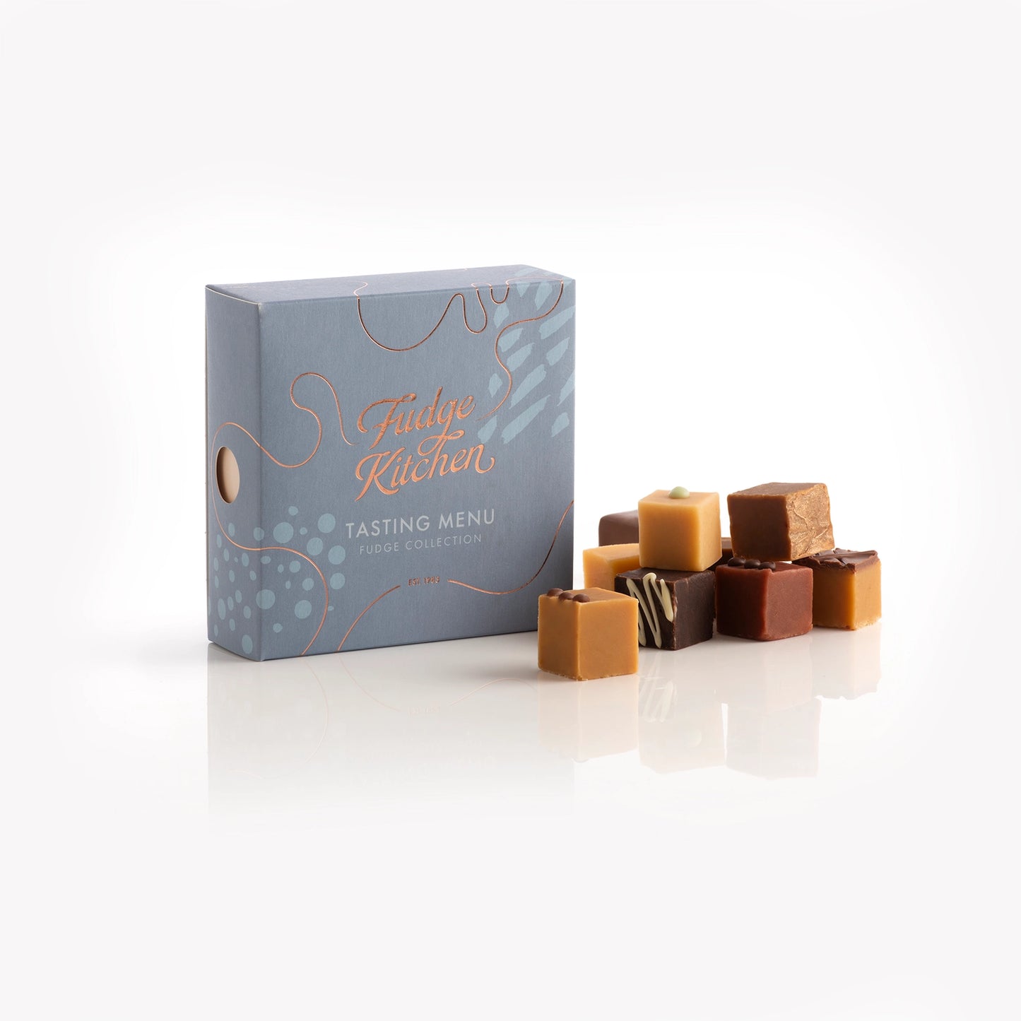 Fudge Kitchen Tasting Menu gift box with nine assorted handcrafted fudge pieces.