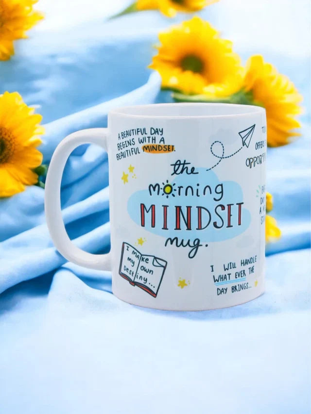 Positive Morning Affirmation Mug with inspiring quotes and sunflowers in the background.