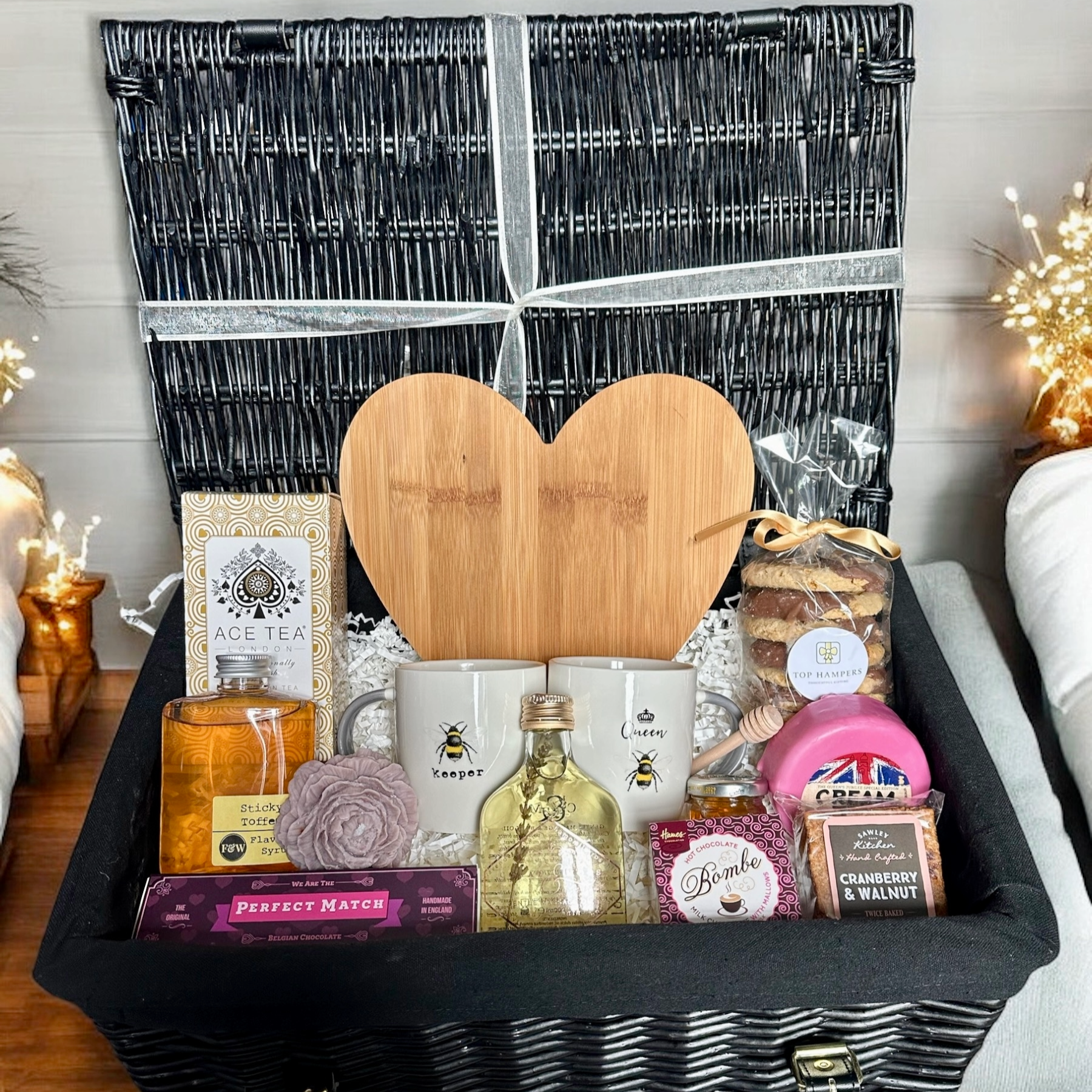 The Perfect Match gift basket with heart-shaped wooden board, craft items, and gourmet snacks.