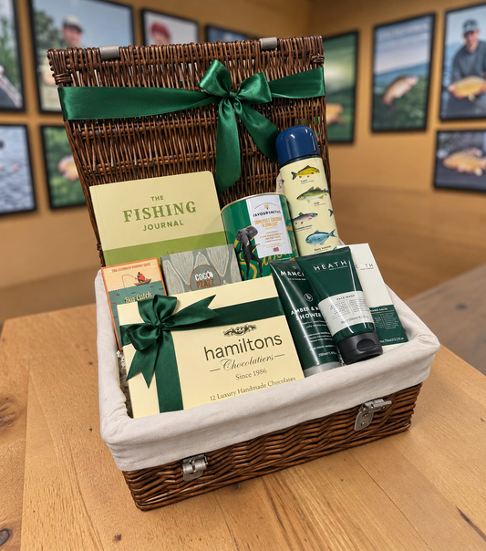 The Angler’s Retreat fishing gift hamper with fishing journal, flask, chocolates, treats and grooming gifts.