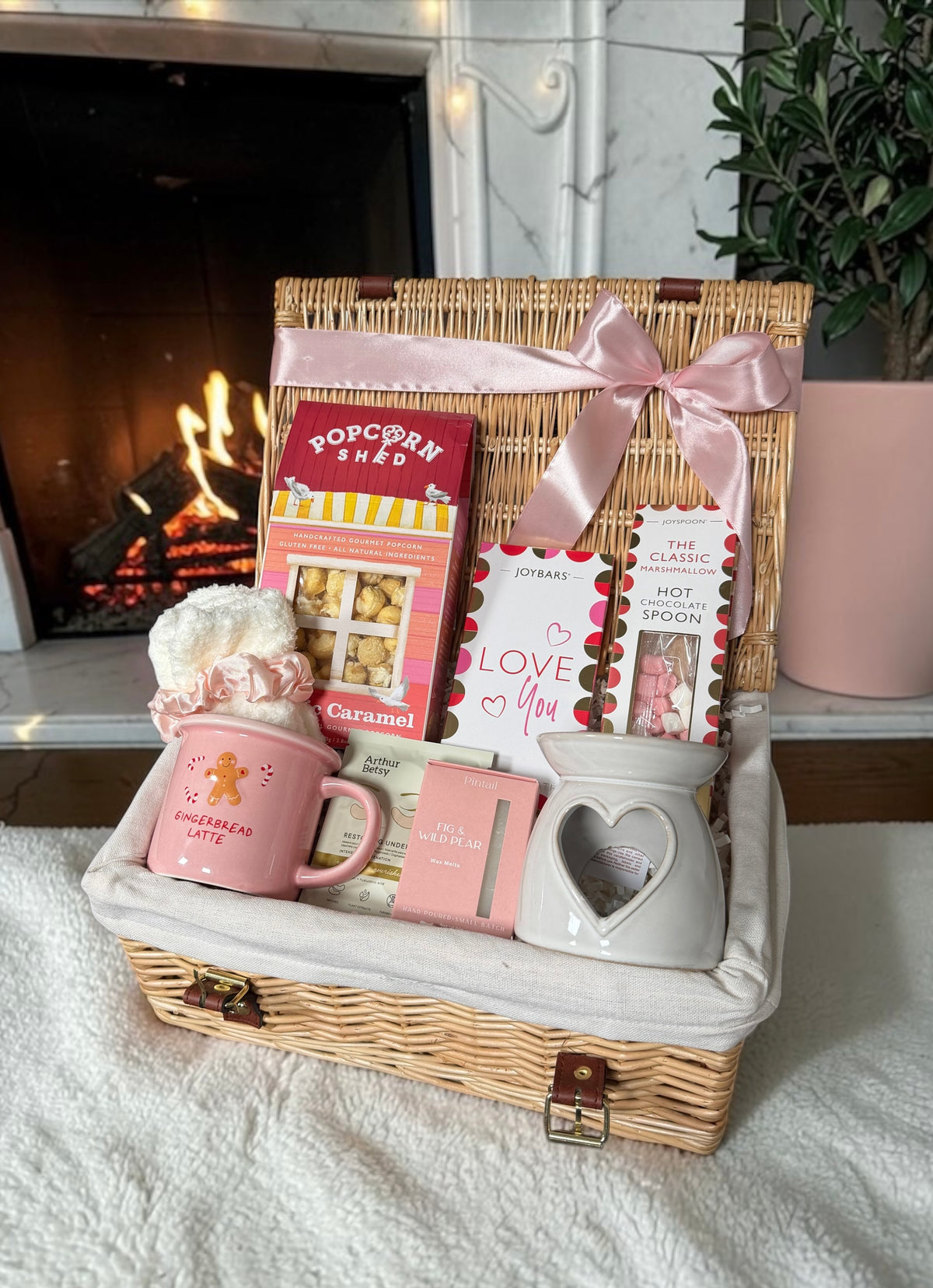 The Cosy Comforts Love Hamper with a gingerbread latte mug, popcorn, heart oil burner and hot chocolate spoon. A cosy gift for Valentine's or any day.