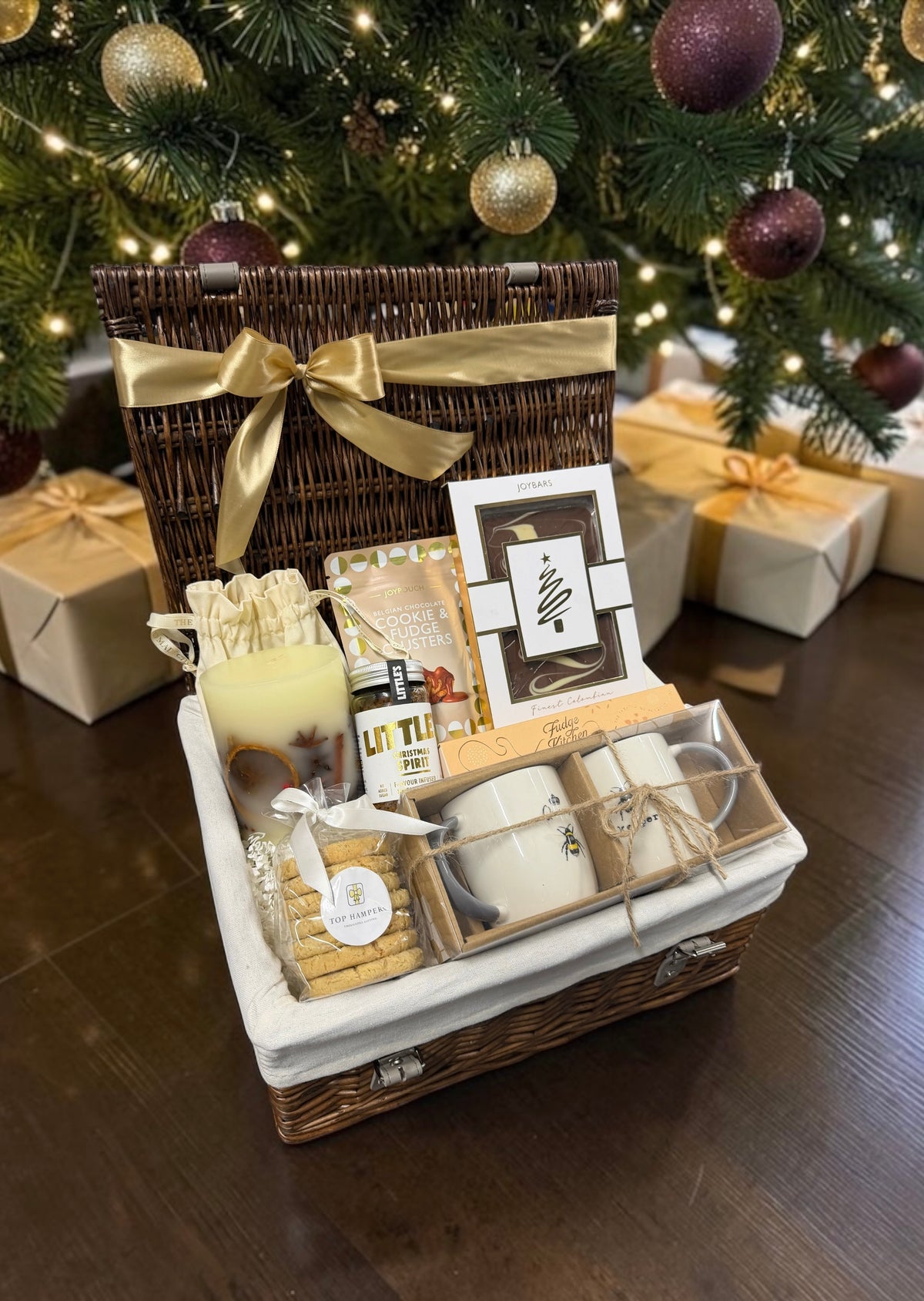 The Cosy Couples Christmas Hamper with matching mugs, a scented candle, festive coffee and fudge. A lovely shared gift for Christmas.