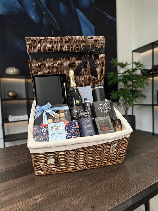 The Executive Champagne Hamper, with Lanson champagne, a journal, chocolates, tea, coffee and a diffuser. A premium corporate gift.