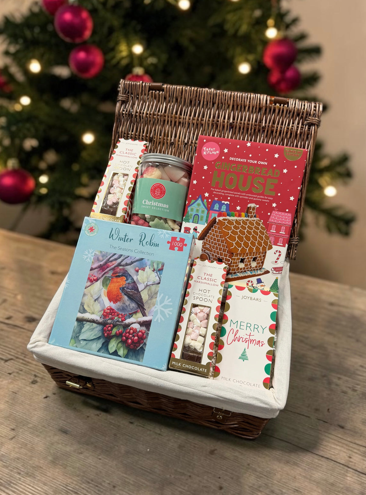 An evening of festive family fun, with a 1000-piece festive jigsaw, gingerbread house kit, sweets, chocolate and marshmallow hot chocolate spoons.