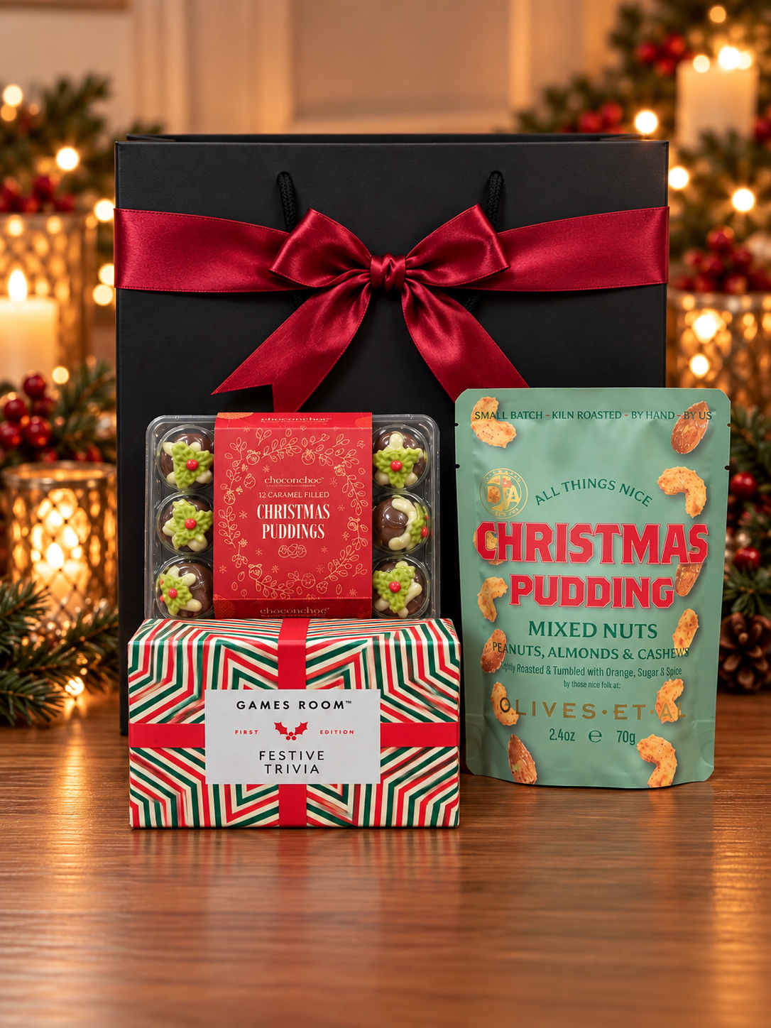 The Festive Trivia and Treats Gift Bag brings a Christmas quiz, caramel-filled chocolate Christmas puddings and spiced Christmas pudding mixed nuts.