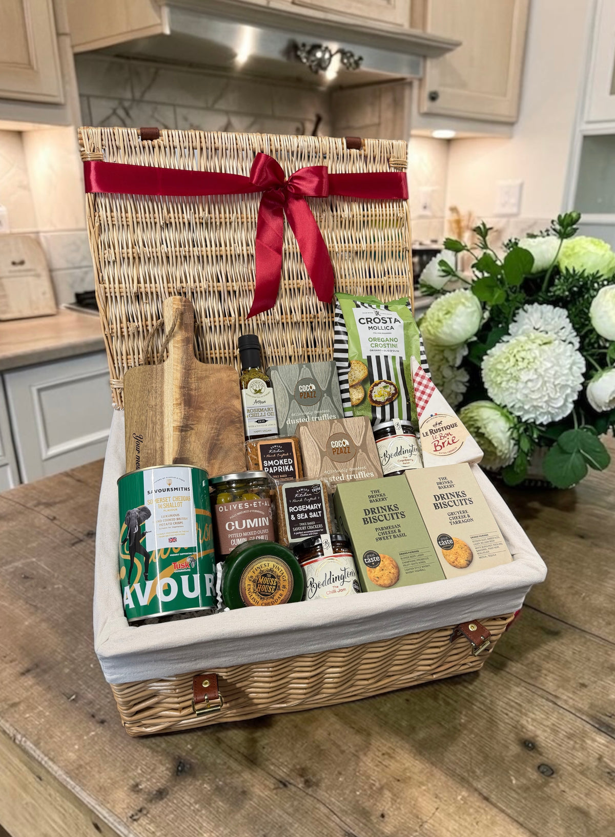 The Gourmet Grazing Hamper with wooden board, cheese, oil, crackers, preserves, sweet treats and more. A generous foodie gift for any occasion.