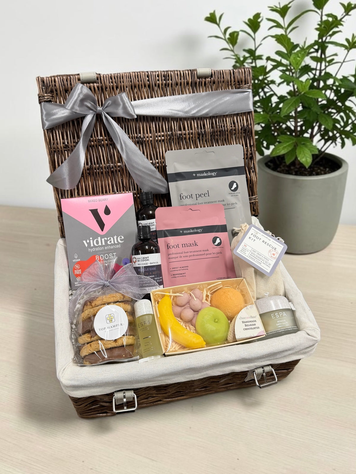 The Sports Recovery Hamper brings ESPA bath salts and body oil, massage oils, foot treatments, a hydration boost and sweet treats.