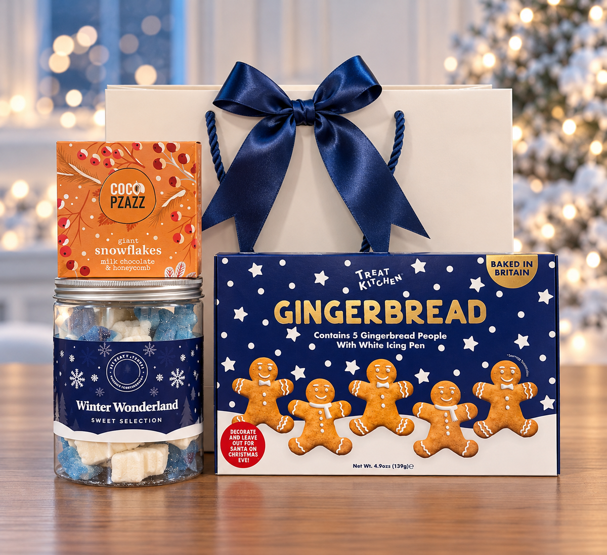 The Winter Wonderland Treats Gift Bag Set brings gingerbread people to decorate, a sweet selection and honeycomb chocolate snowflakes.