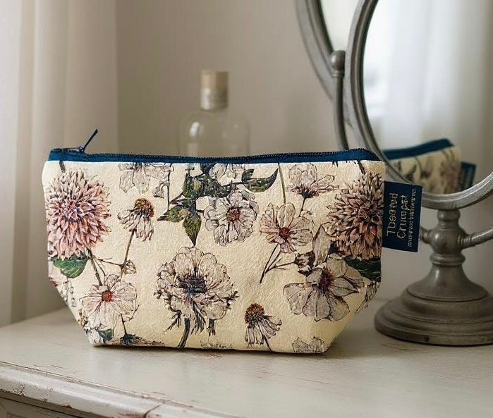 The Blanc Collection Pure makeup bag by Toasted Crumpet – elegant zip pouch with floral design, ideal for daily beauty essentials.