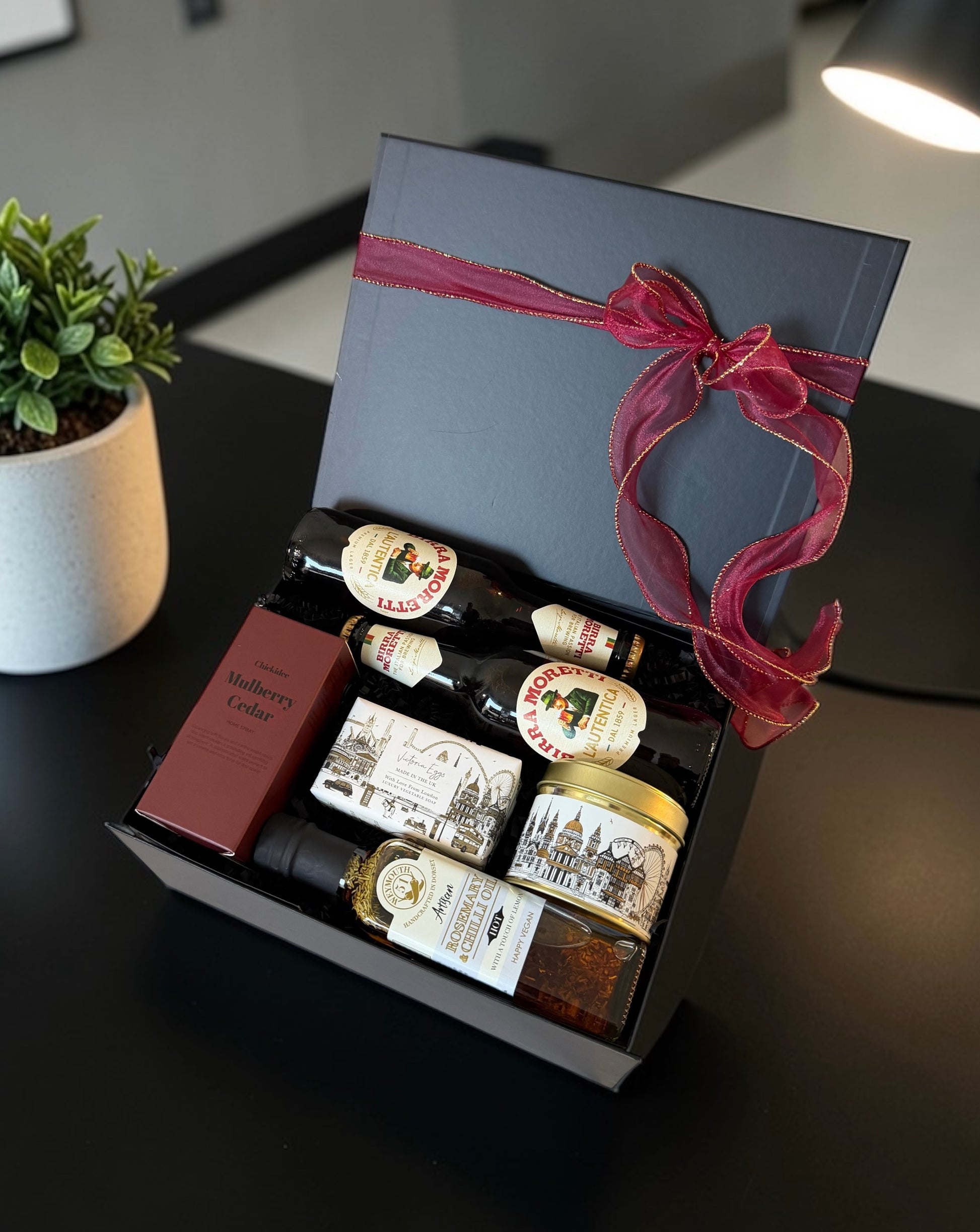 Corporate gift hamper with Champagne or Birra Moretti, candle, home spray, infused oil and luxury soap.