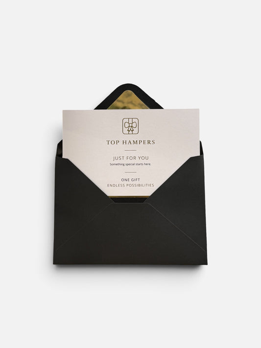 A black envelope with a white gift card partially pulled out, featuring the TOP HAMPERS logo and the words 'JUST FOR YOU' and 'ONE GIFT ENDLESS POSSIBILITIES' on a clean white background.