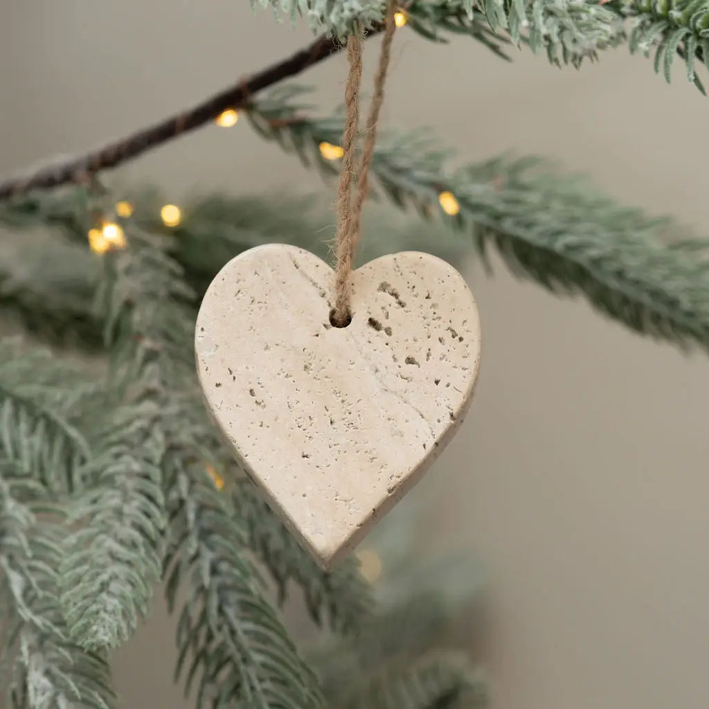 Natural travertine heart adds rustic charm and warmth to any space—simple, sweet, and timeless.