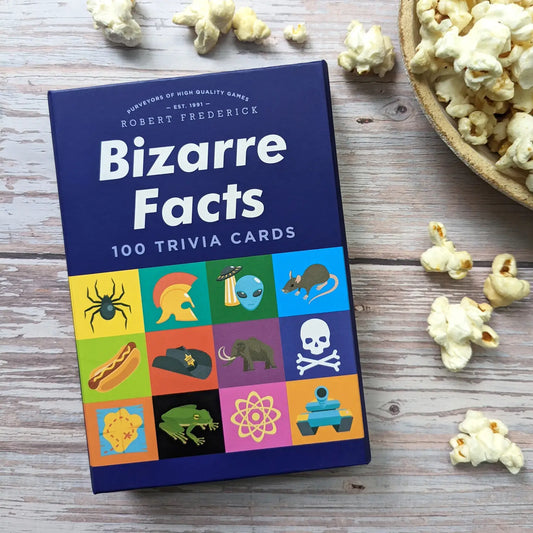 Trivia Cards - Bizarre Facts box on wood with popcorn scattered around.
