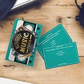 Ultimate Music Trivia game cards on a wooden table.