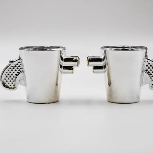 Silver revolver shaped shot glasses set of 2, unique design, gift for gun enthusiasts.