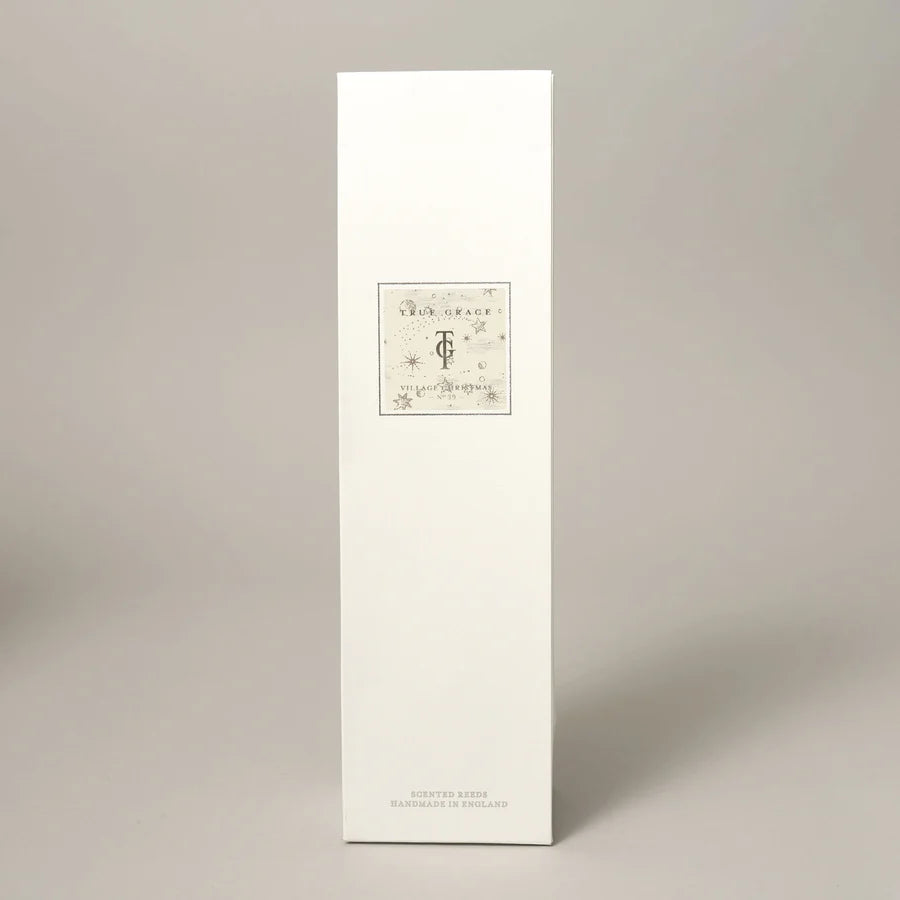 True Grace Village Christmas 200ml Room Diffuser Set with etched glass bottle, natural rattan reeds, and rich festive fragrance diffuser oil.