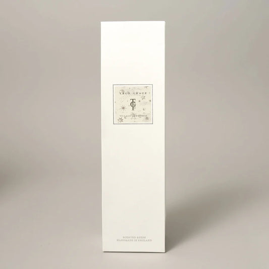 True Grace Village Christmas 200ml Room Diffuser Set with etched glass bottle, natural rattan reeds, and rich festive fragrance diffuser oil.
