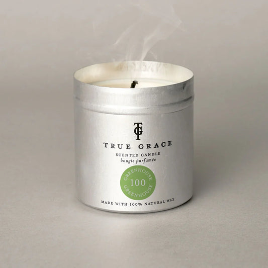 True Grace Greenhouse scented tin candle with silver container.