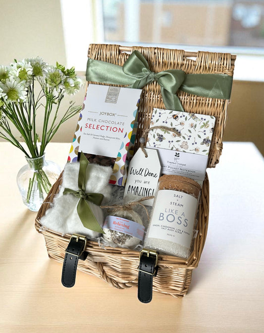 Chocolate, socks, bath bomb, plaque, notebook & scrub — the perfect treat to relax and celebrate.