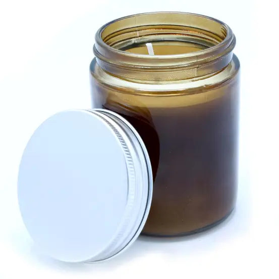 Peace Aromatherapy Candle in glass jar with lid, featuring lavender and geranium oils for a calming ambiance.