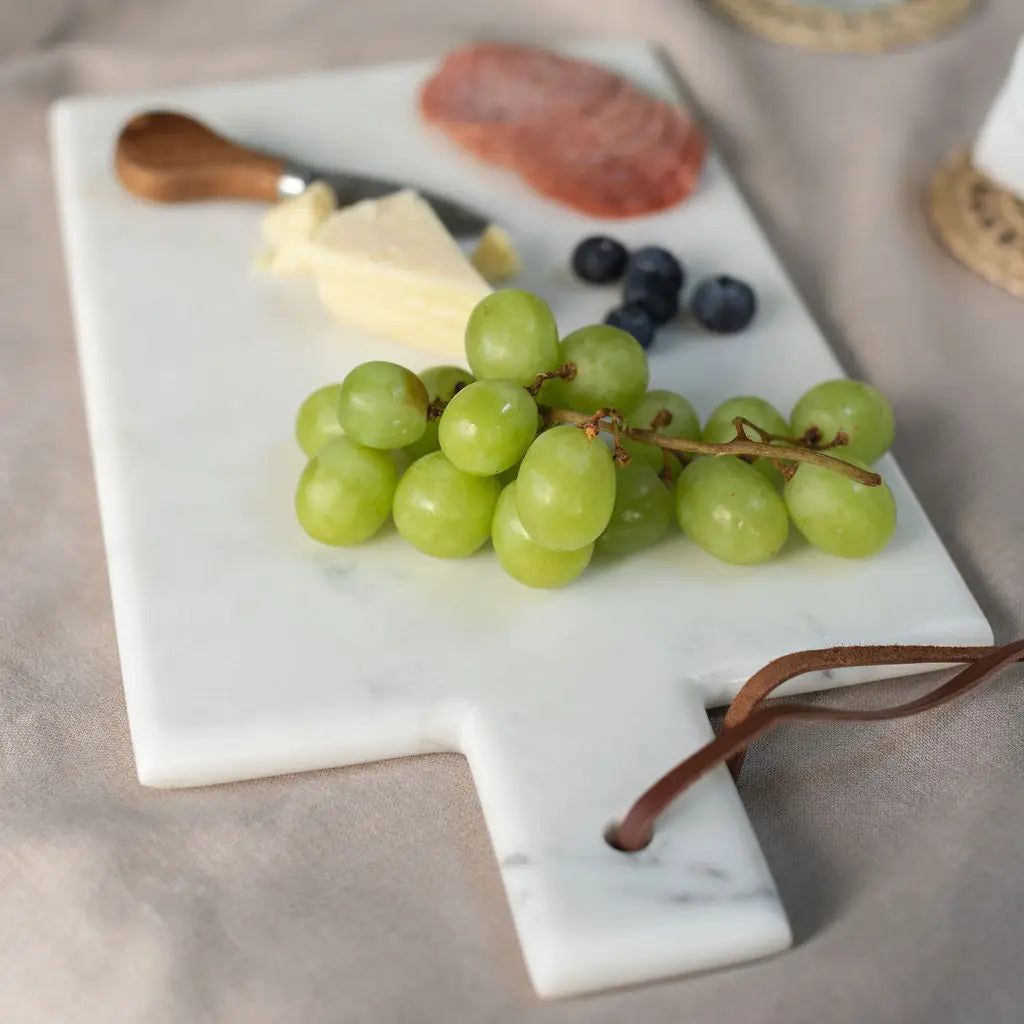 Sleek white marble board offers clean, durable prep with timeless elegance for any kitchen.