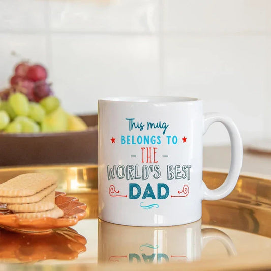 Words Best Dad mug on a kitchen tray with cookies and fruit.