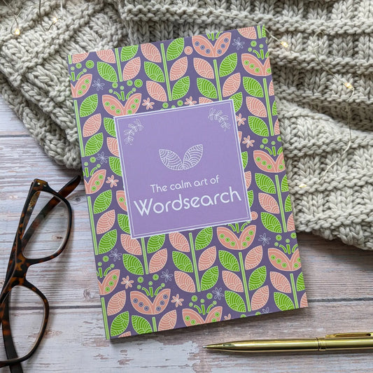 Wordsearch book for grown-ups with a calming purple cover and floral design, ideal for relaxation.
