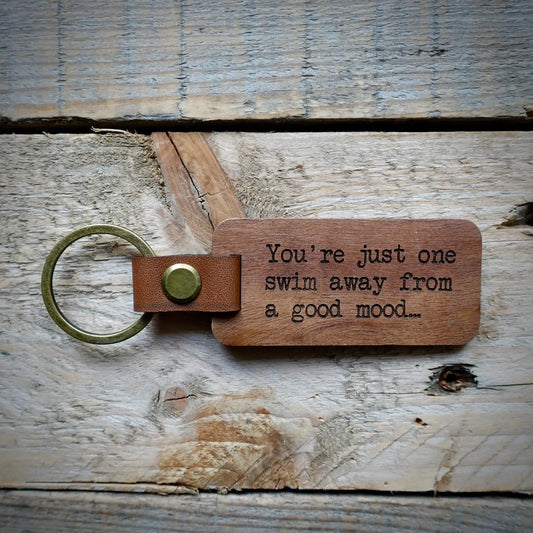 You’re one swim away from a good mood. Carry this wooden keyring as a daily reminder!