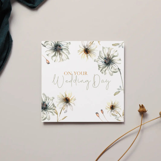 Elegant floral "On Your Wedding Day" card with delicate flower design.