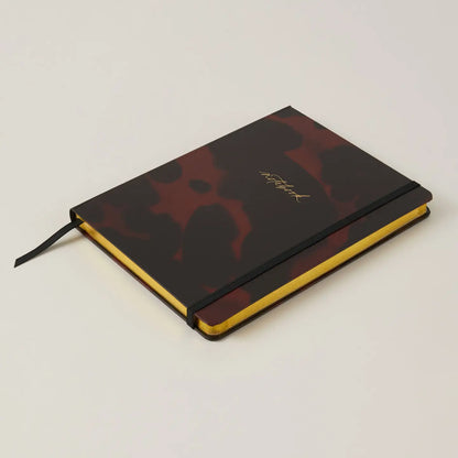 Luxury Notebook in Tortoise design, compact and stylish for modern gentlemen.