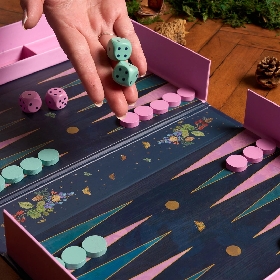 Elegant backgammon set with book-style case and decorative board for two-player games.