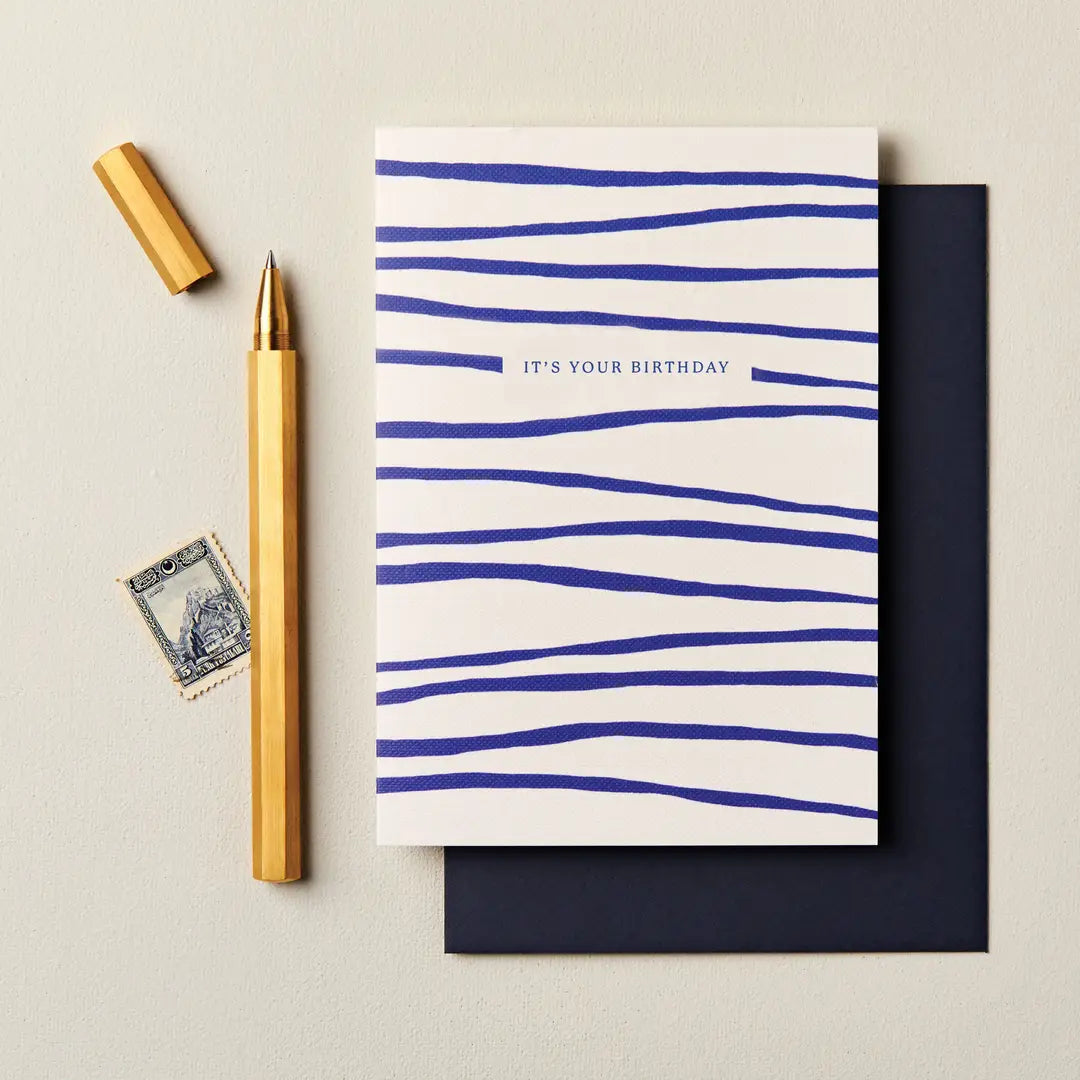 Contemporary birthday card with blue stripe design and “It’s Your Birthday” message.