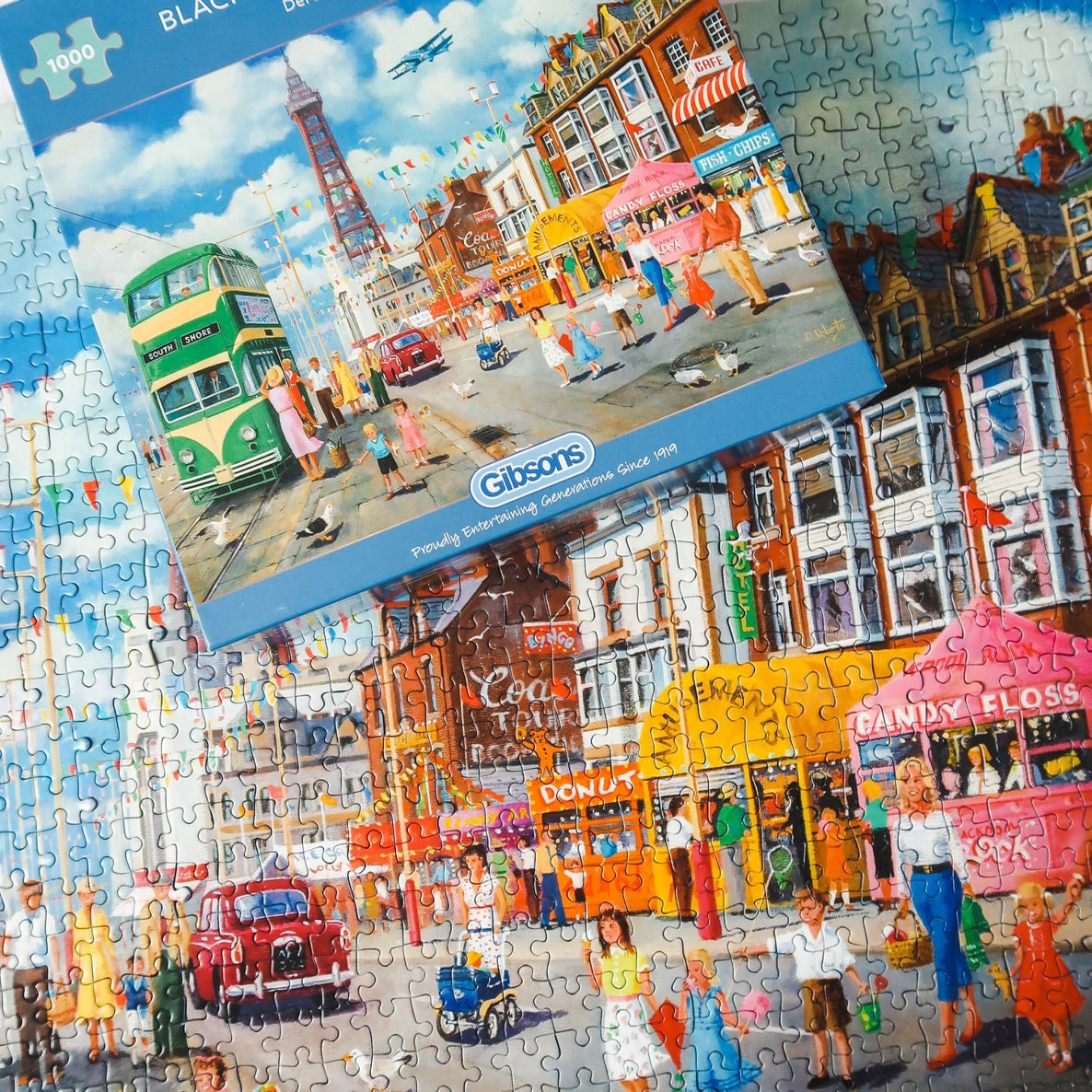 1000-piece Blackpool jigsaw puzzle illustrated by Derek Roberts showing Blackpool Tower, trams and lively seaside scenes.