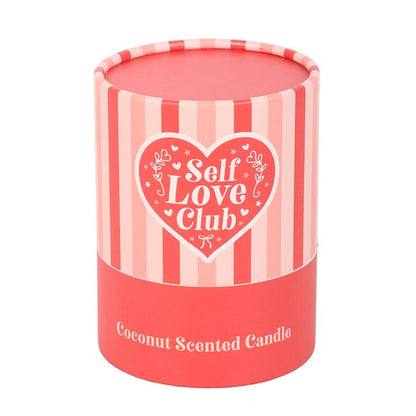 Pink candle with 'Self Love Club' design.