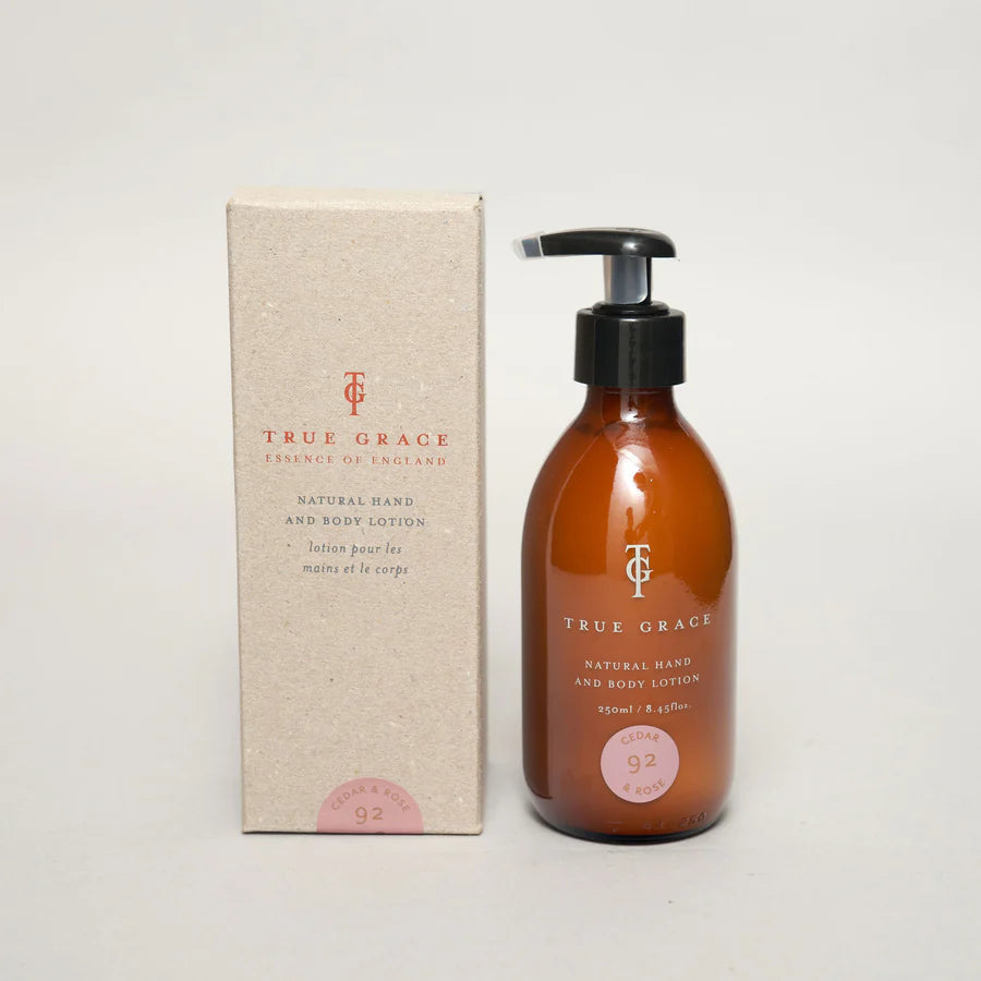 true grace cedar & rose hand and body lotion in elegant bottle.