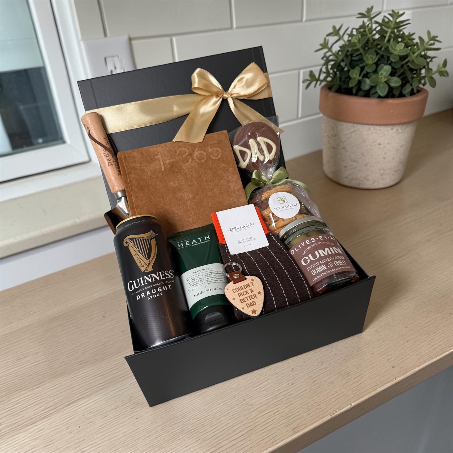 Cheers Dad gift box with journal, chocolate lollipop, socks, olives, biscuits, keyring and choice of beer, wine or soft drink.