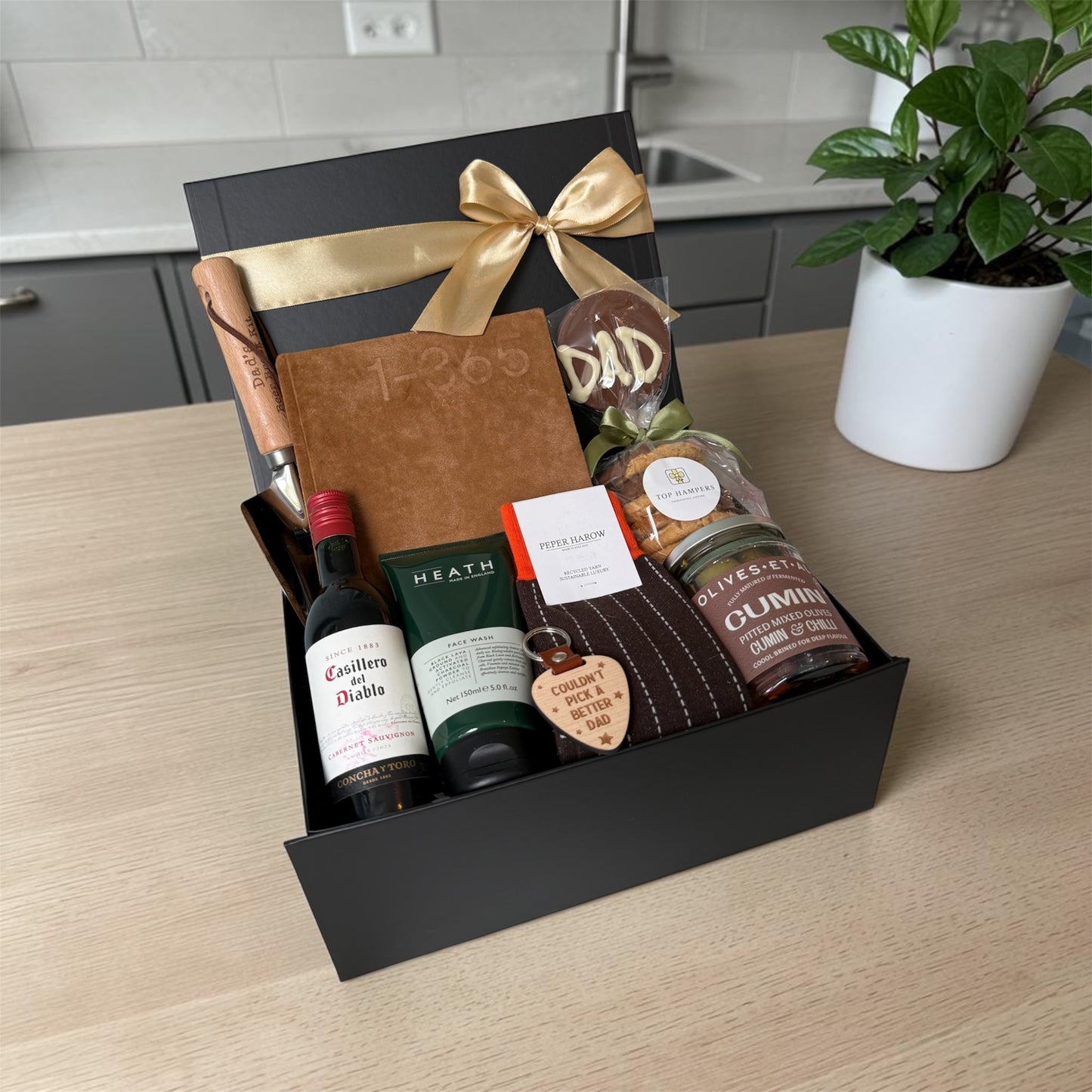 Cheers Dad gift box with journal, chocolate lollipop, socks, olives, biscuits, keyring and choice of beer, wine or soft drink.