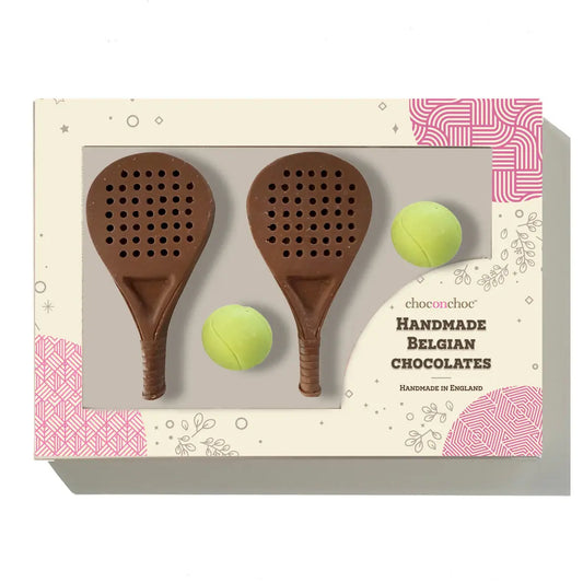 Chocolate padel gift set with caramel filled padel balls and milk chocolate padel rackets.