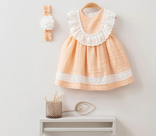Pretty peach cotton vintage baby dress with matching headband.