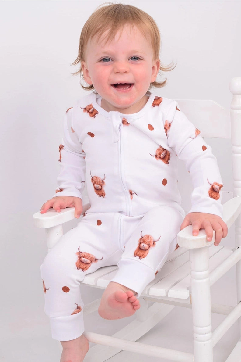 Organic cotton baby sleepsuits, soft and cosy, designed for comfort and everyday wear for little ones.