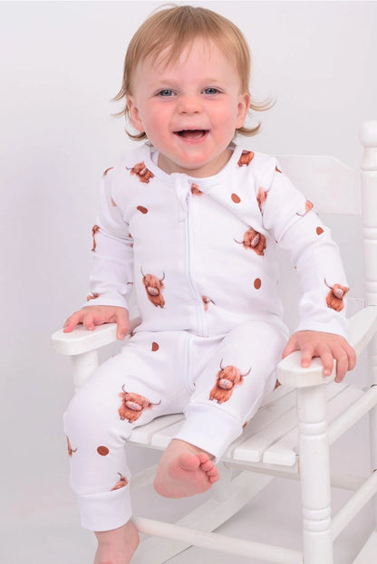 Organic cotton baby sleepsuits, soft and cosy, designed for comfort and everyday wear for little ones.