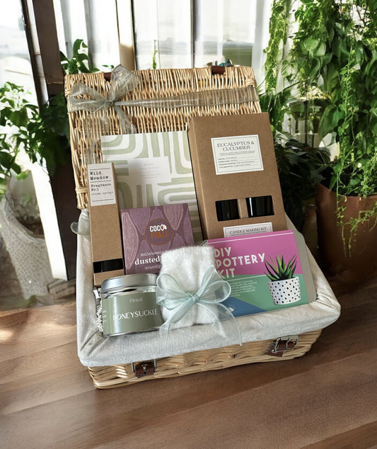 arts and crafts gift hamper with diy pottery kit, notebook and candle making kit