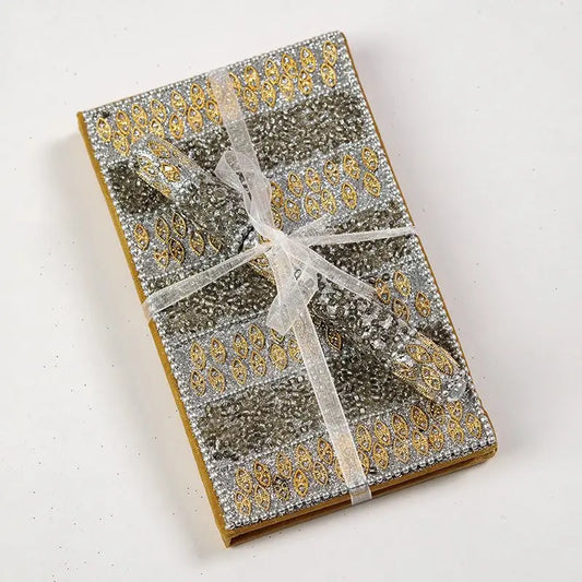 Cream and Gold Beaded Notebook and Pen Set wrapped with ribbon.